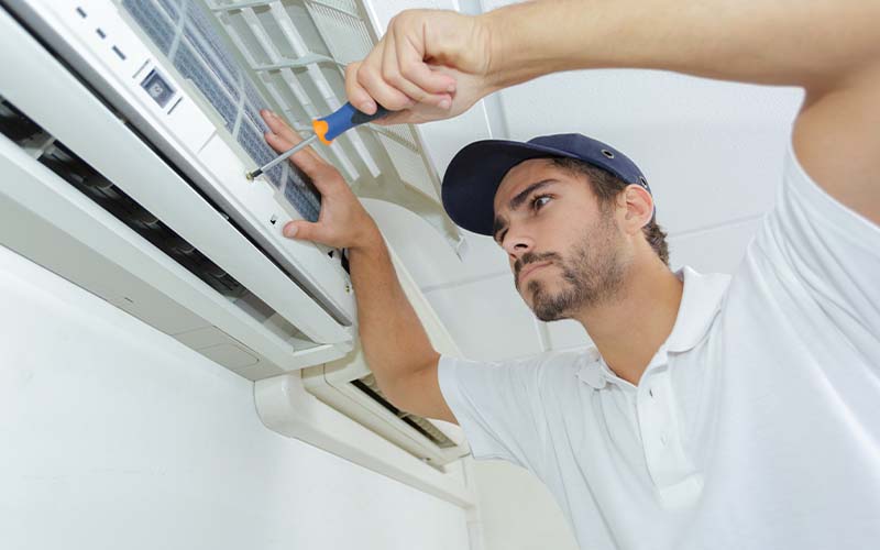 AC expert technician repairing air conditioner