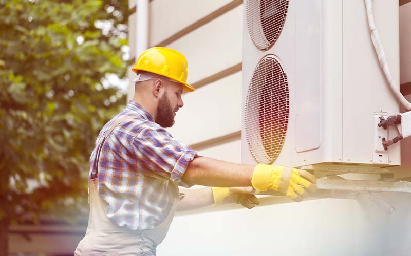 Air Conditioning Expert installing AC unit