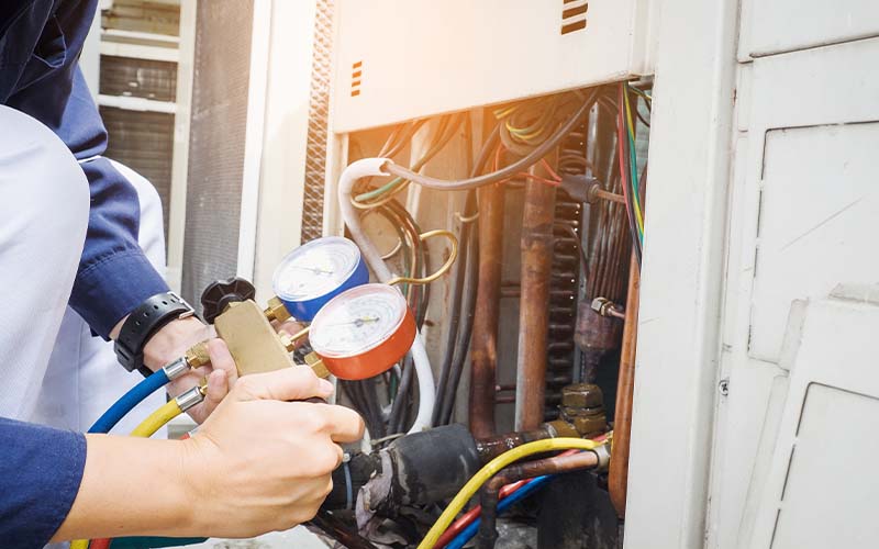 AC Technician is checking heater