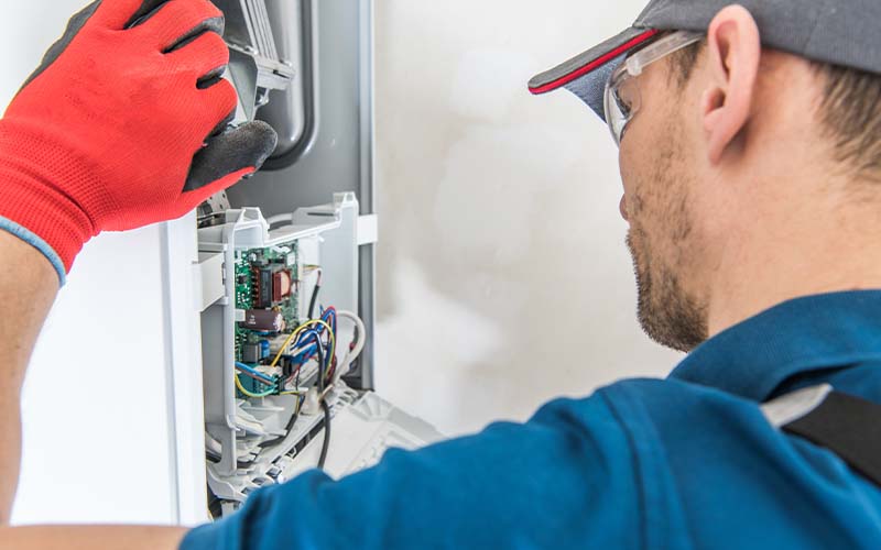 AC Technician addressing the Heater Issue