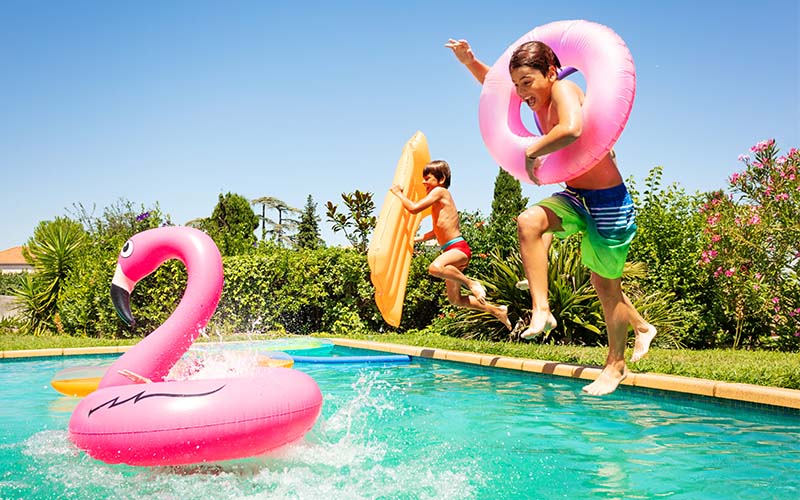 Happy friends enjoying pool party